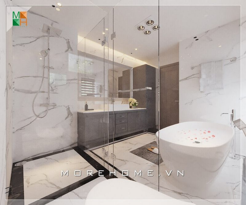 . Với diện tích lớn, phòng tắm có thể được chia thành các khu vực bằng vách tắm bằng kính cường lực như khu vực tắm đứng, khu vực vệ sinh, khu vực tắm bồn và khu tủ lavabo. Điều này giúp ngăn nước và giữ sàn khô ráo, cũng như tạo ra một không gian liên kết trong phòng tắm.